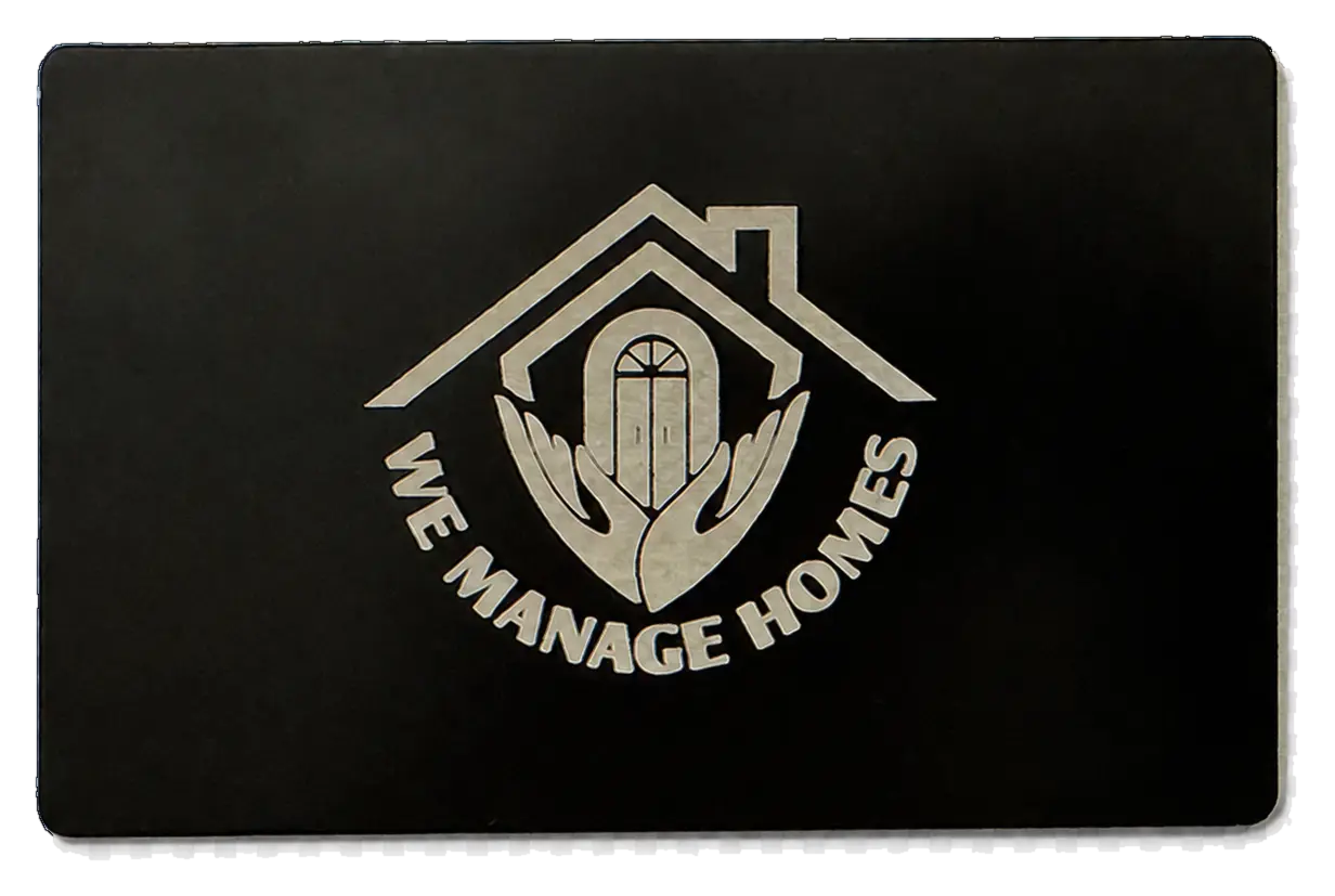 We Manage Homes custom engraved black metal Pick Card with house logo